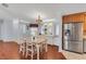 Inviting dining room featuring wood floors, a charming chandelier, and a built-in display cabinet at 520 Canal Way, Oldsmar, FL 34677