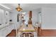 Bright dining room with beautiful light fixture and dining table at 520 Canal Way, Oldsmar, FL 34677