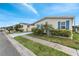 Inviting single-story home with a covered carport, garage, and neatly manicured lawn at 520 Canal Way, Oldsmar, FL 34677