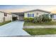 Charming single-story home featuring a carport, garage, and well-maintained landscaping at 520 Canal Way, Oldsmar, FL 34677