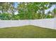 Fully fenced backyard and lush lawn, providing privacy and the ideal setting for outdoor activities at 5245 18Th N St, St Petersburg, FL 33714