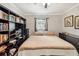 Bedroom featuring a built-in bookcase and a queen-sized bed at 5245 18Th N St, St Petersburg, FL 33714