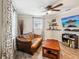 Living room featuring a brown couch, coffee table and a television at 5245 18Th N St, St Petersburg, FL 33714