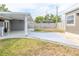 Backyard featuring an outdoor kitchen, a covered patio, manicured grass, and privacy fencing at 5803 Cresthill Dr, Tampa, FL 33615