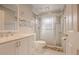 Clean bathroom with glass shower door, tiled walls, and modern fixtures at 5803 Cresthill Dr, Tampa, FL 33615