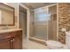 Bathroom with a glass-enclosed shower, a dark wood vanity, and modern tile accents at 5803 Cresthill Dr, Tampa, FL 33615