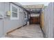 Carport with an air conditioner and access to the backyard at 5803 Cresthill Dr, Tampa, FL 33615