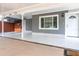 Welcoming front entrance with a covered carport and tiled patio at 5803 Cresthill Dr, Tampa, FL 33615