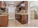 Modern kitchen with granite countertops, stainless steel appliances, and tile backsplash at 5803 Cresthill Dr, Tampa, FL 33615