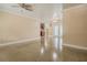 Bright living room featuring a view into the kitchen and french doors leading to the lanai at 5803 Cresthill Dr, Tampa, FL 33615