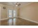 Comfortable living room with tile flooring and glass patio doors at 5803 Cresthill Dr, Tampa, FL 33615