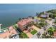 Aerial view of stunning waterfront home with lush landscaping and private boat dock at 5810 Mariner St, Tampa, FL 33609