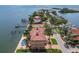 Aerial view of waterfront estate with pool, docks, and manicured landscaping at 5810 Mariner St, Tampa, FL 33609