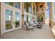 Spacious balcony with elegant seating and large windows, providing captivating waterfront views at 5810 Mariner St, Tampa, FL 33609