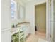 Bathroom vanity featuring a light-filled window and decorative mirror at 5810 Mariner St, Tampa, FL 33609