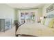 Cozy bedroom with soft green walls, water views, and calming decor at 5810 Mariner St, Tampa, FL 33609