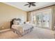 Inviting bedroom with plush carpeting and access to a charming private balcony at 5810 Mariner St, Tampa, FL 33609