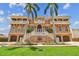 Elegant multi-story home with a grand entrance staircase and multiple balconies at 5810 Mariner St, Tampa, FL 33609