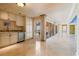 Hallway with tile floors, wet bar with granite counters and access to an outside deck at 5810 Mariner St, Tampa, FL 33609
