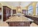 Large island with gorgeous stone countertops in this gourmet kitchen with stainless appliances and water view at 5810 Mariner St, Tampa, FL 33609