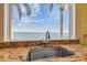 Granite countertops surround the sink with views of palm trees and the water at 5810 Mariner St, Tampa, FL 33609