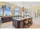 Kitchen island with barstool seating, custom cabinetry, and stunning waterfront views at 5810 Mariner St, Tampa, FL 33609