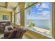 Inviting living room with comfortable seating and expansive windows offering stunning waterfront views at 5810 Mariner St, Tampa, FL 33609