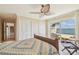 Main bedroom with water view, ceiling fan, and access to the water at 5810 Mariner St, Tampa, FL 33609