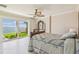 Main bedroom with a view of the water, a ceiling fan, and tiled flooring at 5810 Mariner St, Tampa, FL 33609