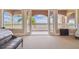 Expansive bedroom featuring three large windows and a bench seat at 5810 Mariner St, Tampa, FL 33609