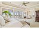 Serene main bedroom with balcony access offering stunning views and natural light at 5810 Mariner St, Tampa, FL 33609