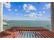 Inviting pool with an ocean view, featuring a wooden pergola for shaded relaxation at 5810 Mariner St, Tampa, FL 33609