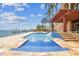 Backyard featuring a swimming pool with fountains and views of the ocean at 5810 Mariner St, Tampa, FL 33609