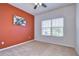 Neutral bedroom featuring carpet, ceiling fan, and a window with bright natural light at 5933 Caldera Ridge Dr, Lithia, FL 33547