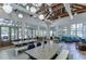 Spacious clubhouse with high ceilings, exposed beams, ample seating, and natural light from large windows at 5933 Caldera Ridge Dr, Lithia, FL 33547