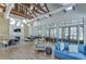 Bright clubhouse interior featuring comfortable seating, dining areas, and large windows overlooking scenic views at 5933 Caldera Ridge Dr, Lithia, FL 33547