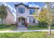 Two-story home with stone accents, manicured lawn, and inviting curb appeal at 5933 Caldera Ridge Dr, Lithia, FL 33547