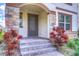 Charming home entrance featuring a stone-accented facade and a decorative front door at 5933 Caldera Ridge Dr, Lithia, FL 33547