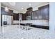 Gourmet kitchen with large island, granite countertops, and stainless steel appliances at 5933 Caldera Ridge Dr, Lithia, FL 33547