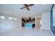 Open living space features tile floors, modern kitchen, and ample natural light at 5933 Caldera Ridge Dr, Lithia, FL 33547
