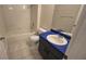 Bathroom with white tiles, blue vanity, and combined shower and tub at 6213 Crickethollow Dr, Riverview, FL 33578