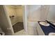 Well-lit bathroom featuring a garden tub, vanity, and a walk-in closet at 6213 Crickethollow Dr, Riverview, FL 33578
