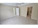 Bright bedroom featuring neutral walls and tile flooring throughout at 6213 Crickethollow Dr, Riverview, FL 33578