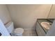 Compact powder room featuring a neutral color palette and vanity at 6213 Crickethollow Dr, Riverview, FL 33578