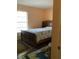 Bedroom with lots of light and a beautiful patterned comforter at 6488 Robinswood Ave, Brooksville, FL 34602
