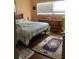 This bedroom features a nice rug and a large window for natural light at 6488 Robinswood Ave, Brooksville, FL 34602