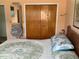Bedroom featuring built-in closet, double bed, and peach colored walls at 6488 Robinswood Ave, Brooksville, FL 34602