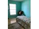 This bedroom features light hardwood floors and lots of natural light at 6488 Robinswood Ave, Brooksville, FL 34602