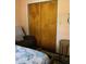 This bedroom has plenty of closet space and a comfortable recliner at 6488 Robinswood Ave, Brooksville, FL 34602