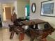 Dining area with unique wood table and chairs at 6488 Robinswood Ave, Brooksville, FL 34602